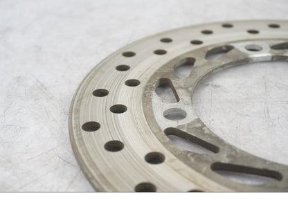 Vänster sida på Bromsskiva från en Honda CBR 125 R -2004 motorcykel.