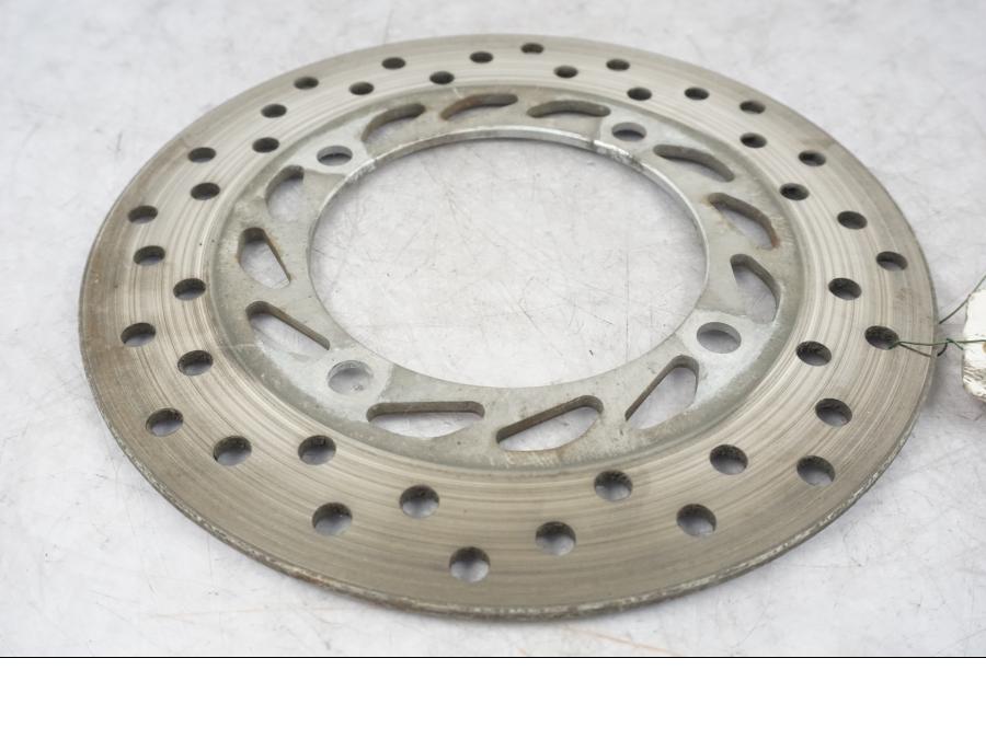 Framsidan på Bromsskiva från en Honda CBR 125 R -2004 motorcykel.