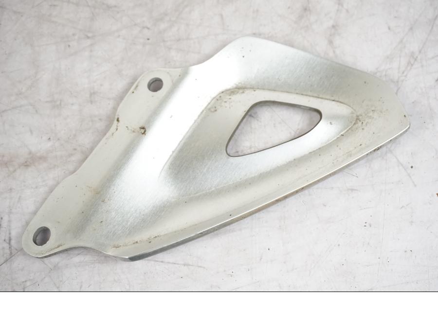 Vänster sida på Hälskydd från en Triumph Tiger -2009 motorcykel.