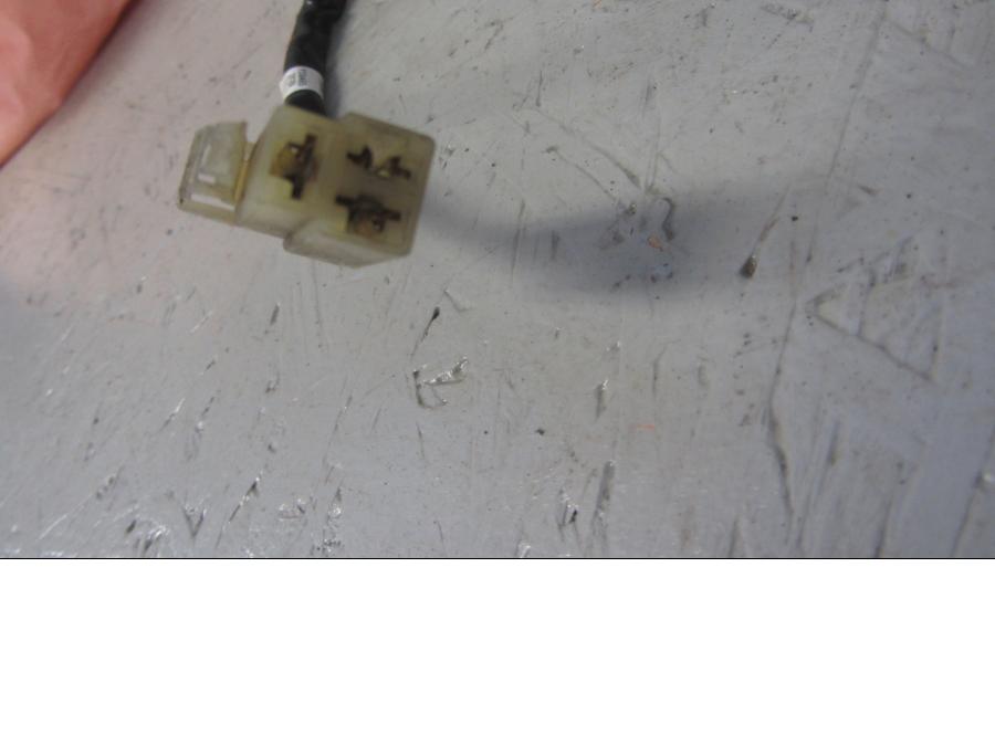 Baksidan på Generator från en Ducati Monster 1100 EVO ABS -2012 motorcykel.