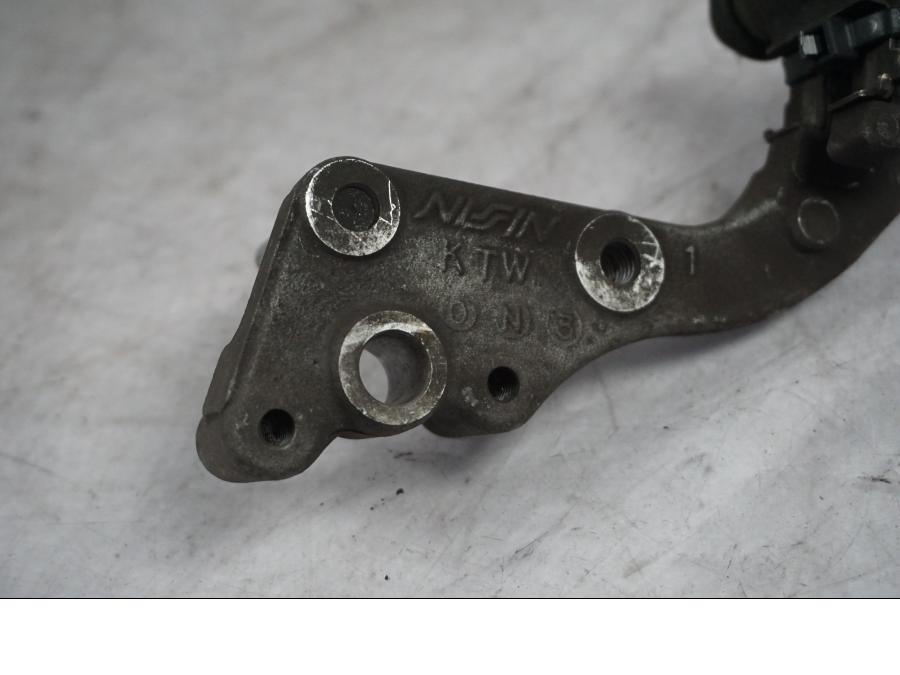 Baksidan på Bromsoksfäste från en Honda SH 300 A -2011 scooter.