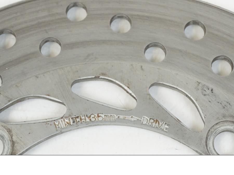 Höger sida på Bromsskiva från en Honda CBR 125 R -2006 motorcykel.