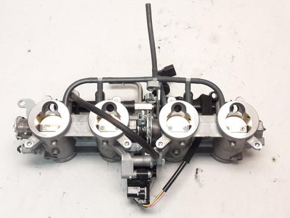 Framsidan på Spjällhus från en Kawasaki Z 800 -2015 motorcykel.