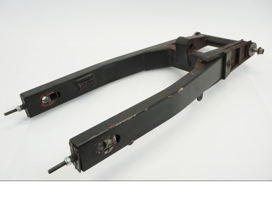 Vänster sida på Sving från en Yamaha WR 125 -2010 motorcykel.