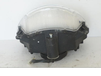 Vänster sida på Strålkastare från en Honda SH 300 A -2011 scooter.