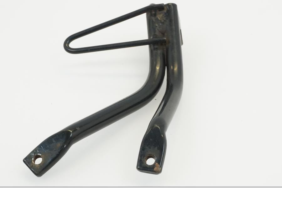 Baksidan på Fotpinnefäste från en Yamaha WR 125 -2010 motorcykel.