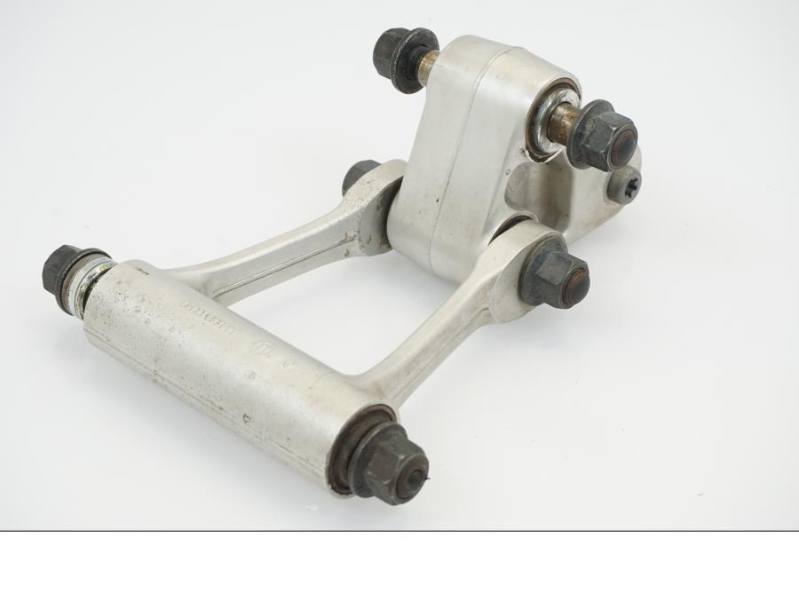 Vänster sida på Stötdämparlänkage från en KTM 690 Duke -2012 motorcykel.