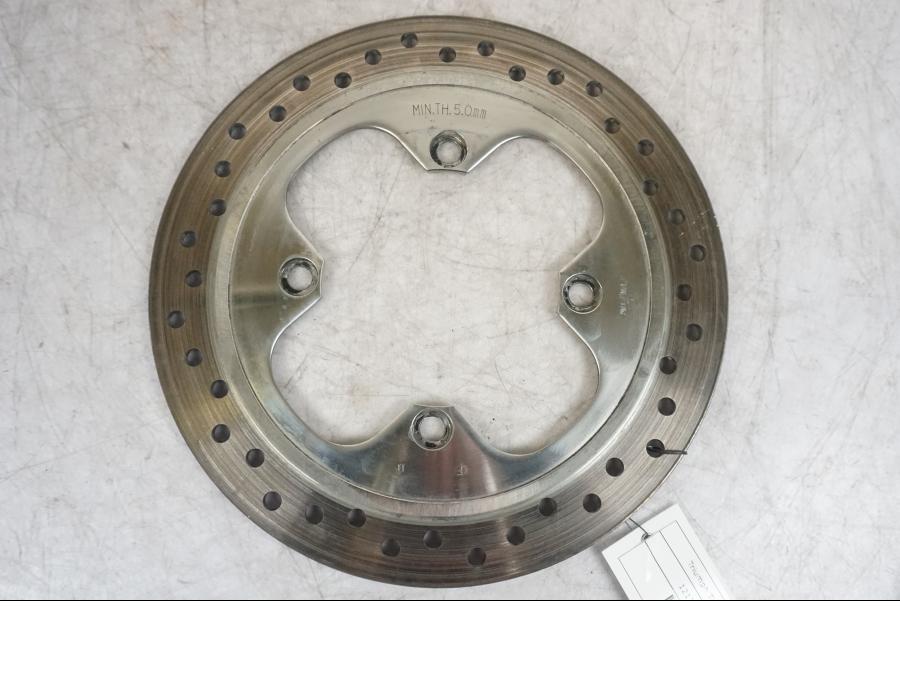 Framsidan på Bromsskiva från en Triumph Tiger -2009 motorcykel.