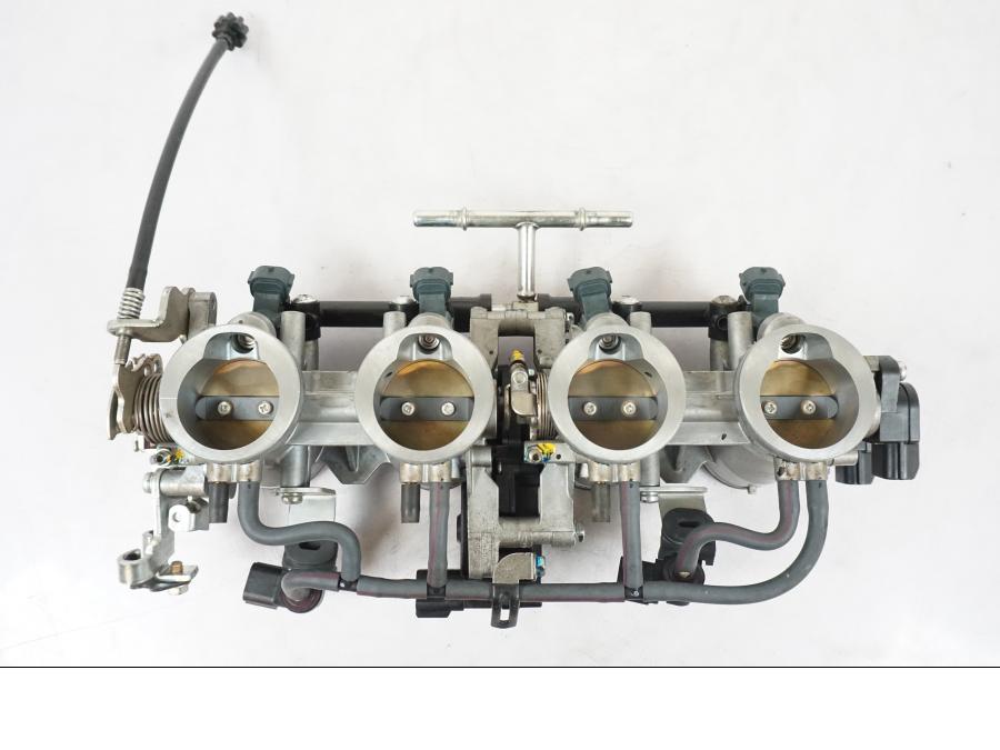 Framsidan på Spjällhus från en Kawasaki ZX-6R -2011 motorcykel.
