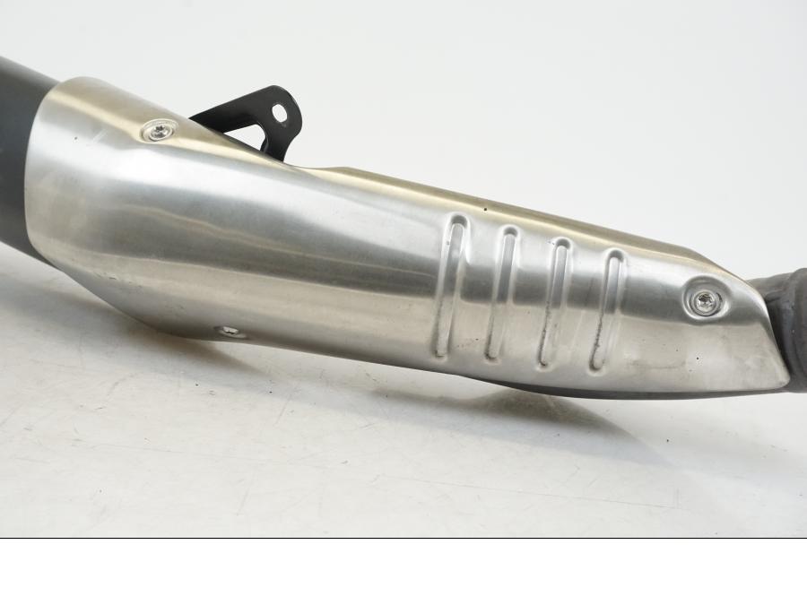 Vänster sida på Ljuddämpare från en Aprilia Tuono V4R -2011 motorcykel.