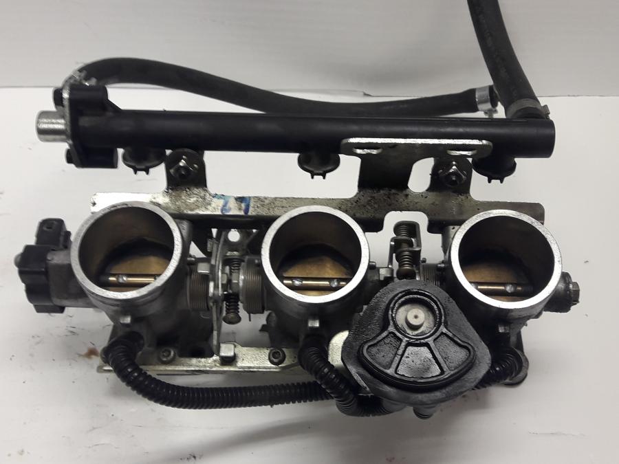 Baksidan på Spjällhus från en Triumph Tiger -1999 motorcykel.