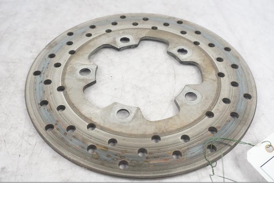 Framsidan på Bromsskiva från en Suzuki SV 1000 -2004 motorcykel.