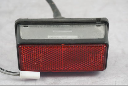 Vänster sida på Skyltbelysning från en Suzuki GSF 1250 -2010 motorcykel.