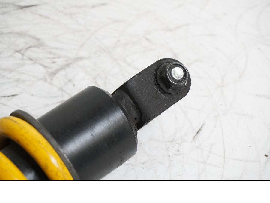 Vänster sida på Stötdämpare från en Yamaha YZF-R 125 -2009 motorcykel.