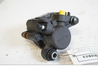 Framsidan på <p>Bromsok bak från Yamaha YZF 1000 R1 2007.</p>

<p>Nissin. Ett kolvs ok.</p> motorcykel.