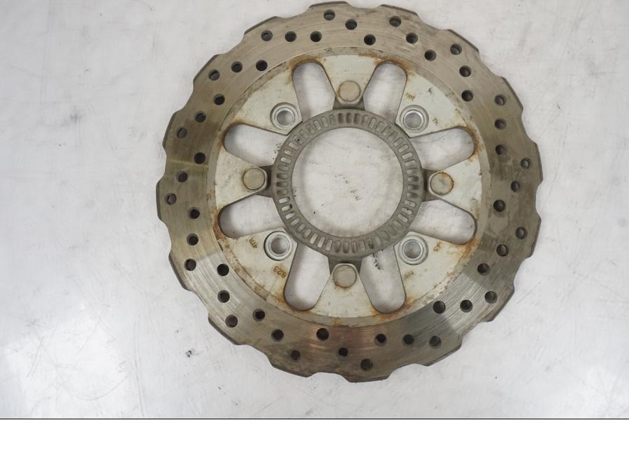 Höger sida på Bromsskiva från en Kawasaki Versys 650 -2014 motorcykel.