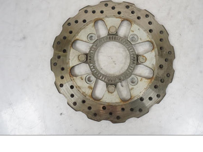 Höger sida på Bromsskiva från en Kawasaki Versys 650 -2014 motorcykel.