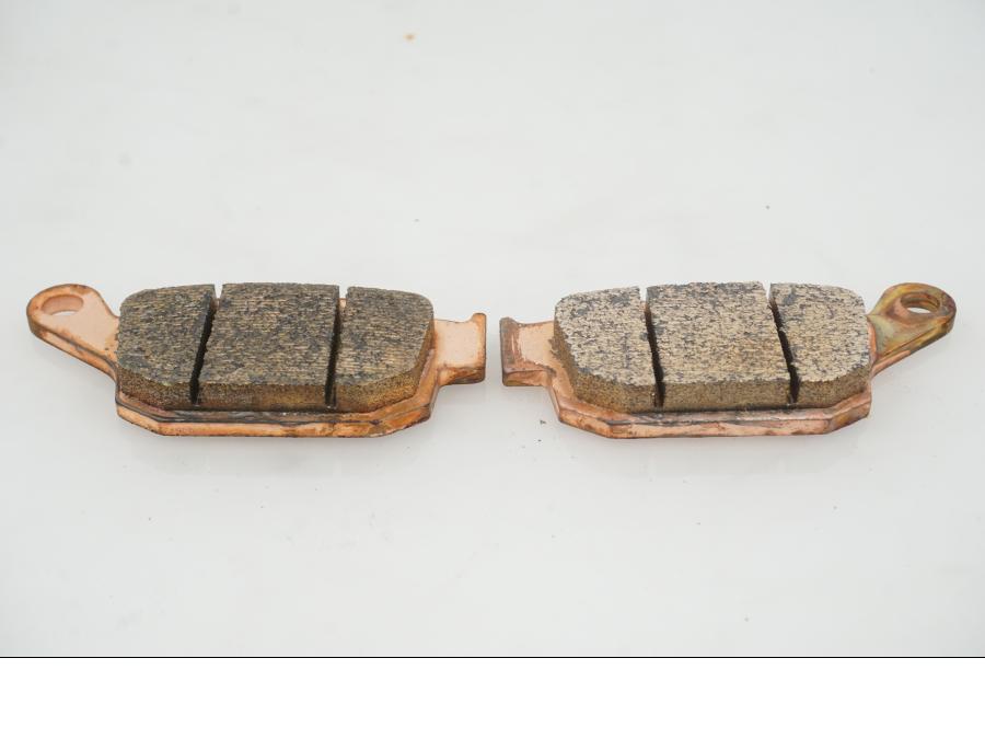 Snett uppifrån på Bromsbelägg från en Universal Universal -1997 motorcykel.