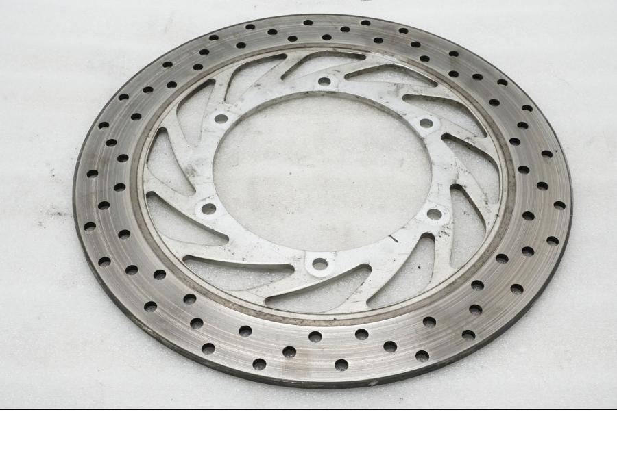 Baksidan på Bromsskiva från en Yamaha XVZ 13TD -1999 motorcykel.