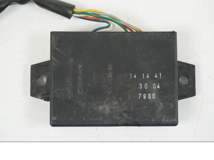 Baksidan på Avgasstyrbox från en Aprilia RS 125 -2008 motorcykel.