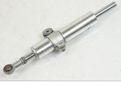 Vänster sida på Styrdämpare från en Aprilia Tuono V4R -2011 motorcykel.