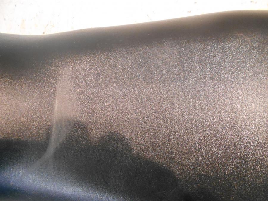 Vänster sida på Sadel från en Honda CBR 125 R -2007 motorcykel.