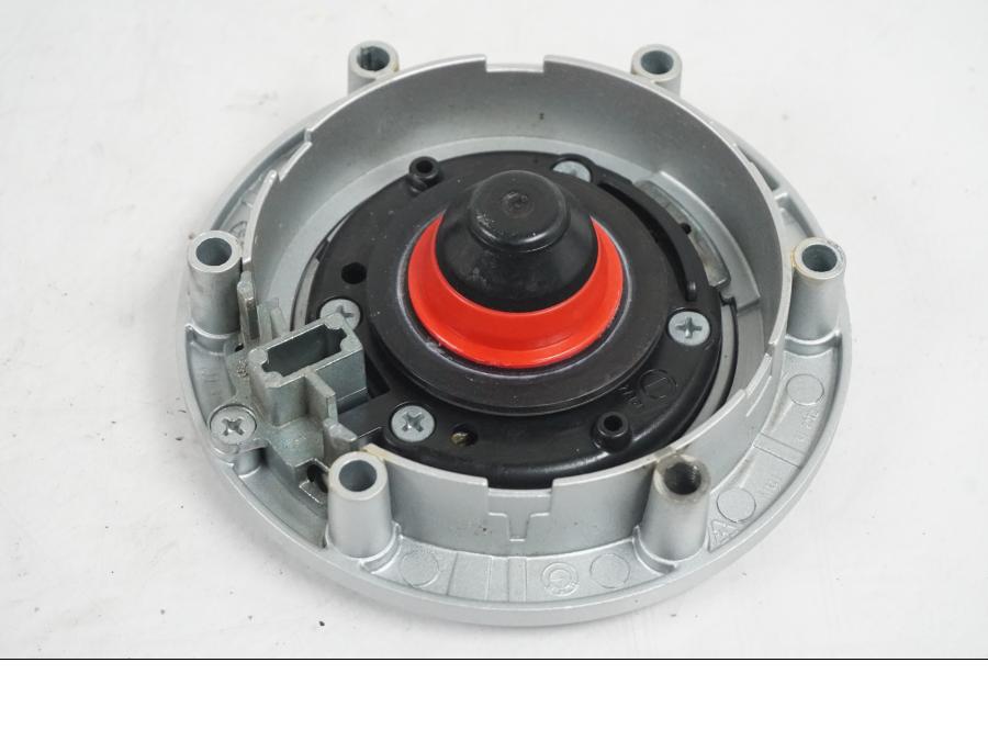 Snett uppifrån på <p>Låssats från BMW R 1200 RT 2013.</p>

<p>Tändningslås (endast mekanismen), tanklock, sadellås, larmdosa, 1st nyckel och 1st dosa.</p> motorcykel.