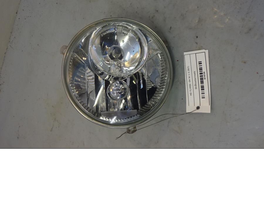 Framsidan på Strålkastarinsats från en H-D Touring Road King Custom FLHRSI -2004 motorcykel.