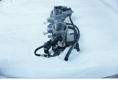 Vänster sida på Spjällhus från en Kawasaki Ninja 650 -2018 motorcykel.