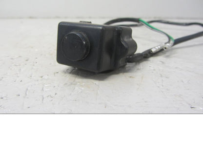 Baksidan på Tryckknappsreglage från en Suzuki LTA 750 XP E -2009 motorcykel.